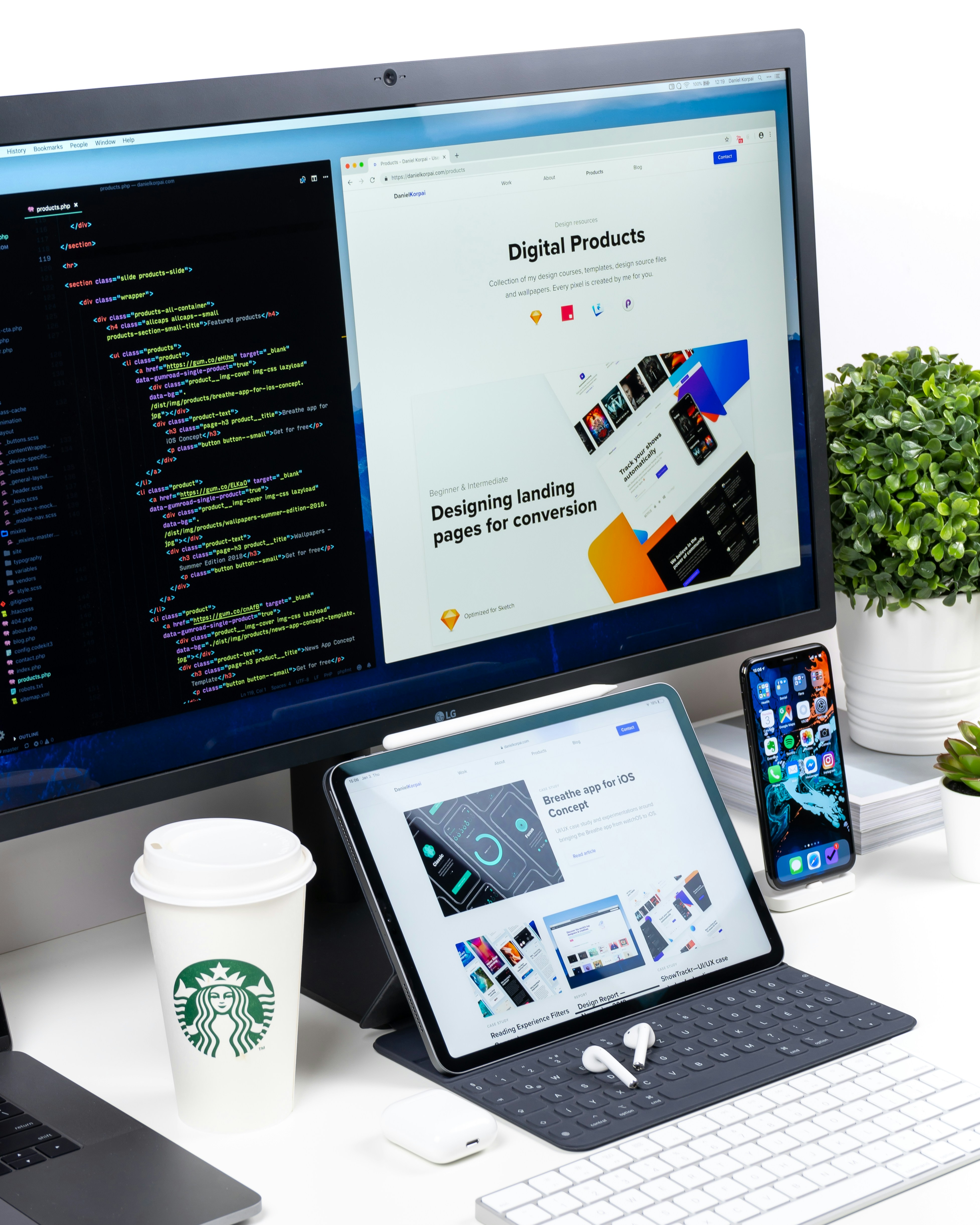 Designer building a modern business website on a dual-screen setup