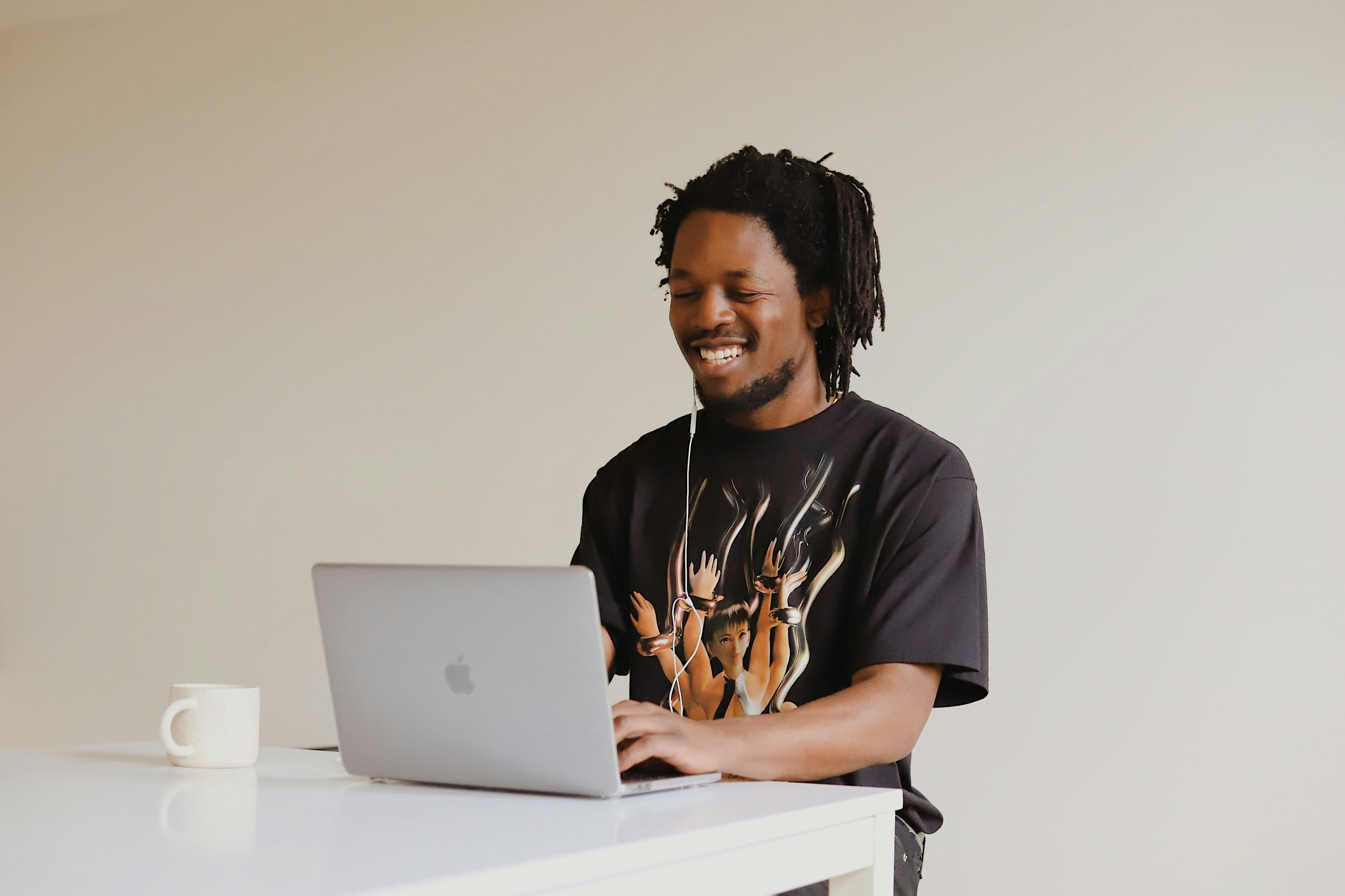 Kenyan university student working remotely on a laptop during a break