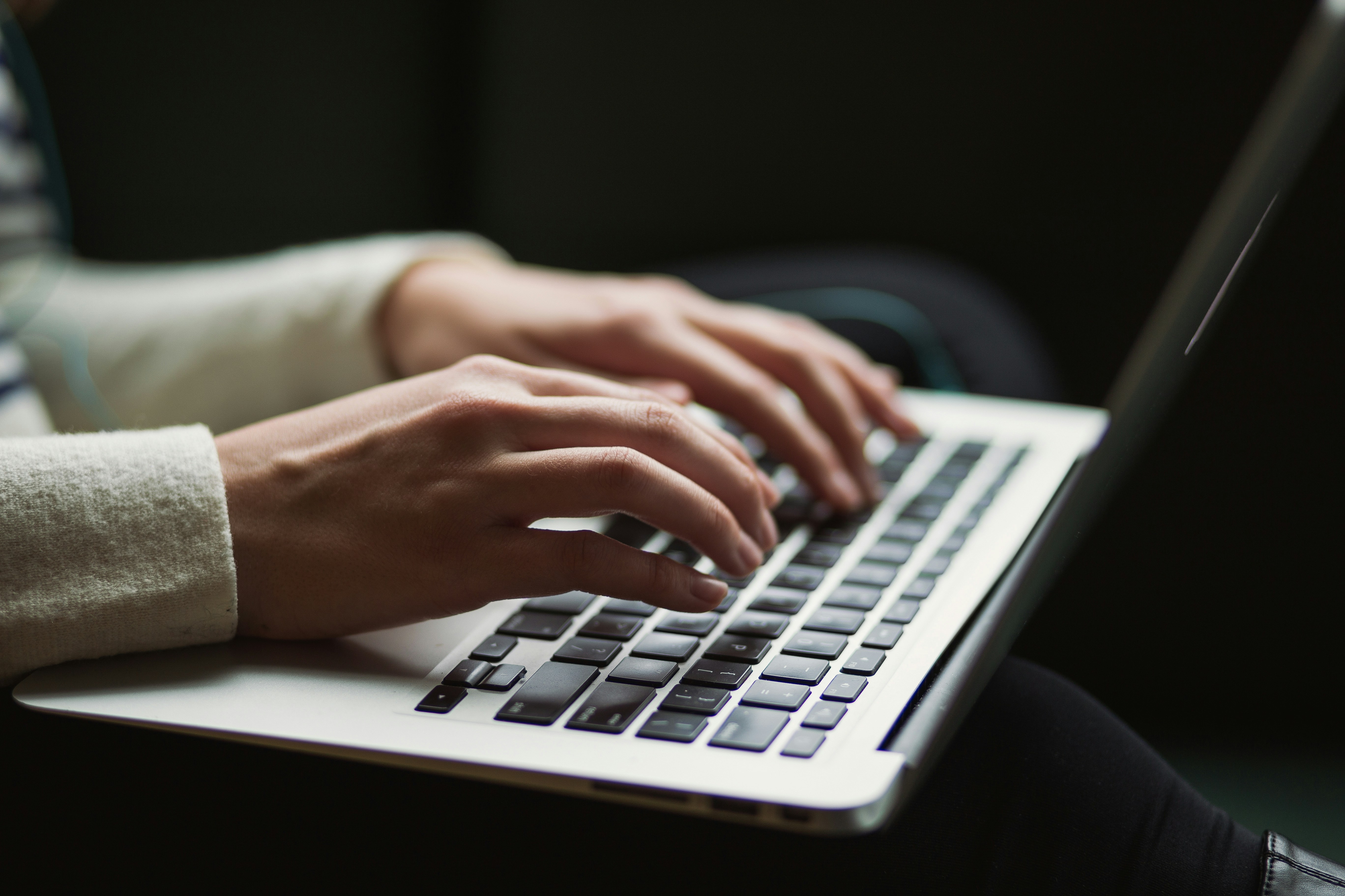 Founder setting up an online business store on a laptop at home