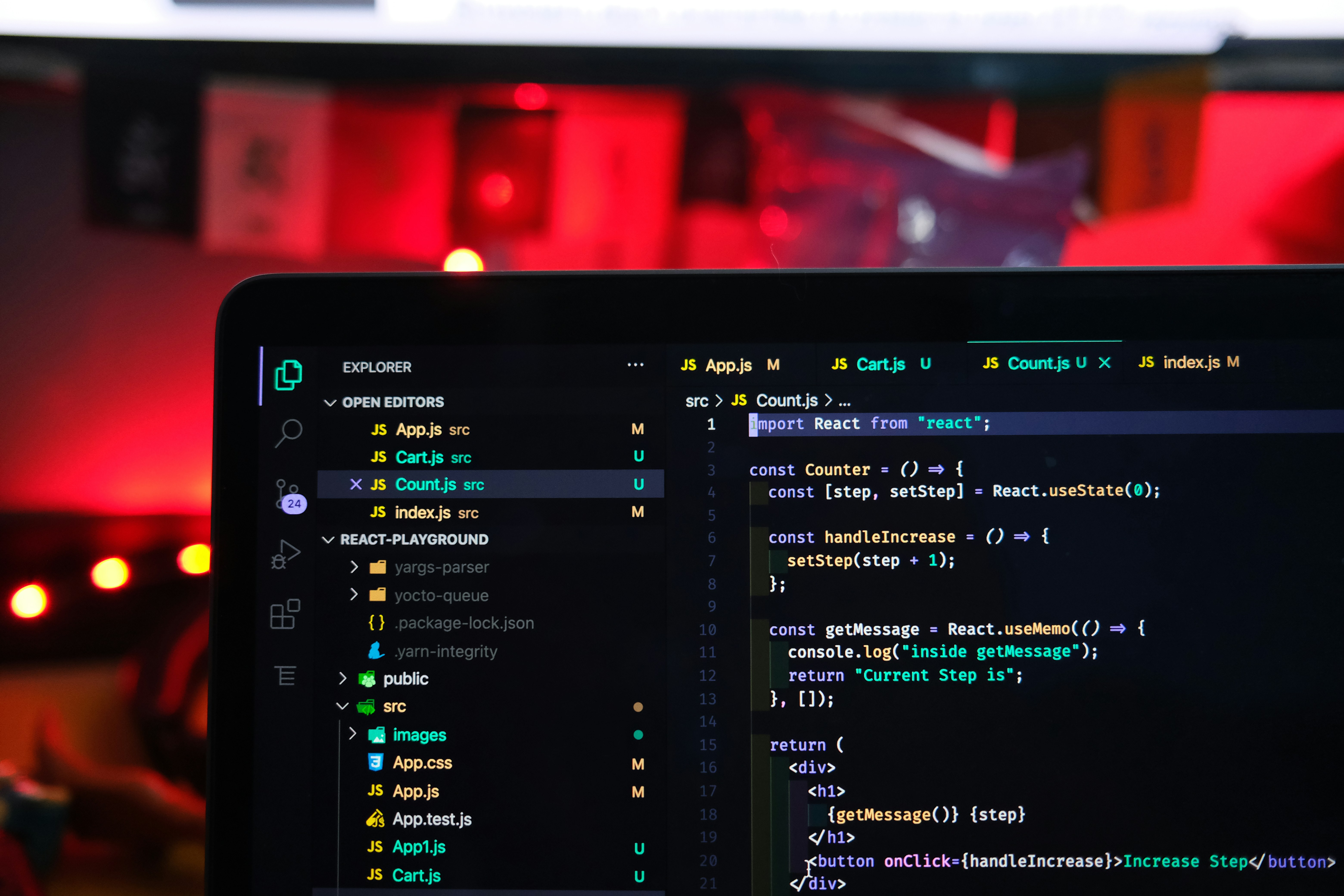 Beginner web developer writing HTML and CSS code at a desk